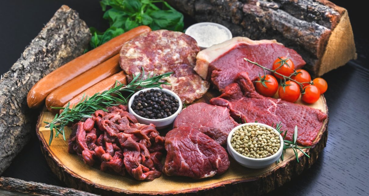 raw meat on white ceramic plate